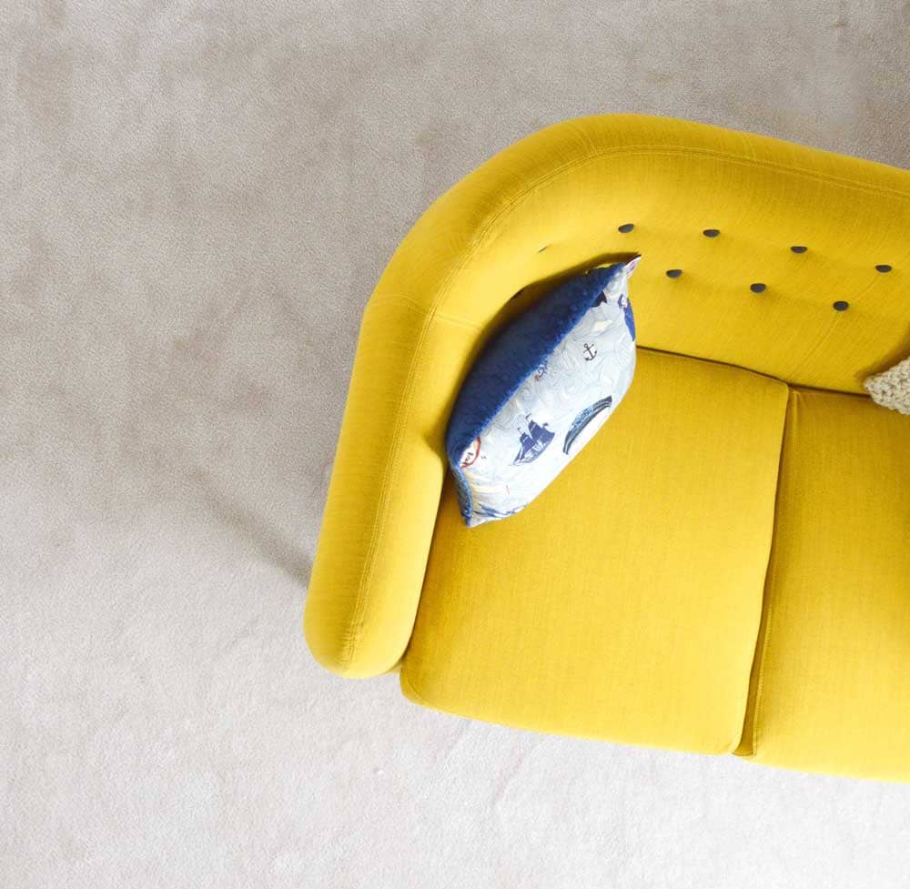 selling house yellow couch